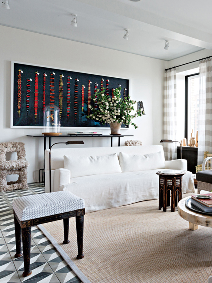 tiled-living-room-with-white-sofa-and-bold-artwork-david-stark-brookyn-via-coco-kelley